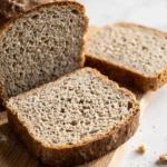 https://sauerteigbacken.de/wp-content/uploads/2026/07/Saftiges-Vollkorn-Sauerteig-Brot-mit-Kokosmehl-selber-backen